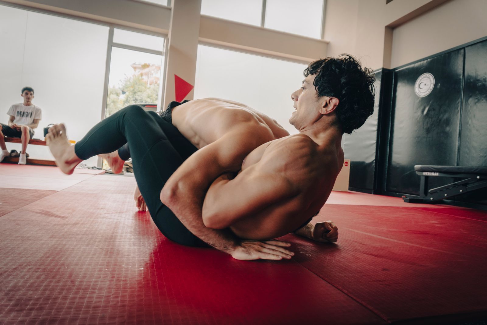 Two athletes grappling No-Gi on the mat, part of a gi vs no gi bjj comparison in Florence, SC