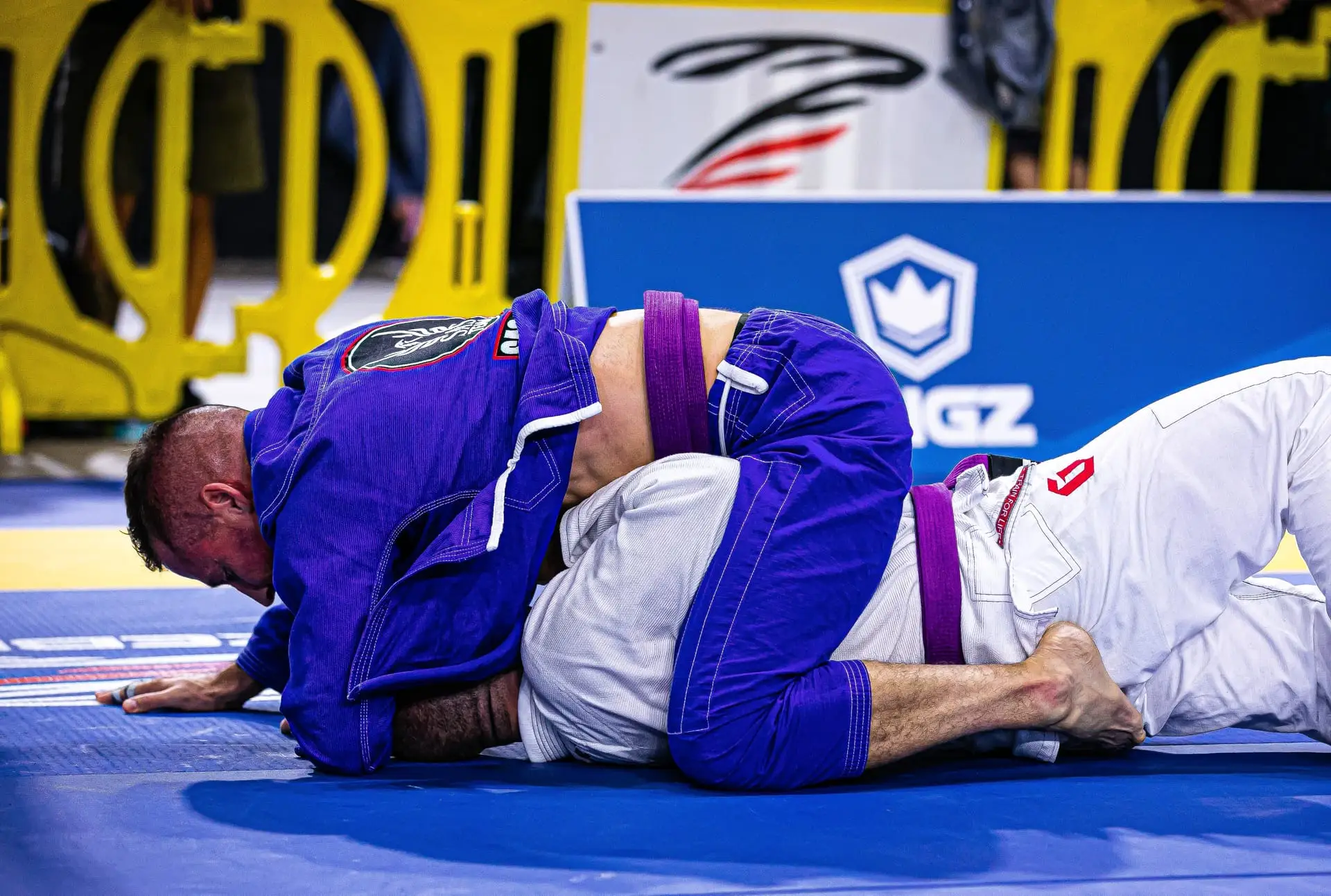 Adults drilling self defense grappling and ground control on the mats in Florence, SC